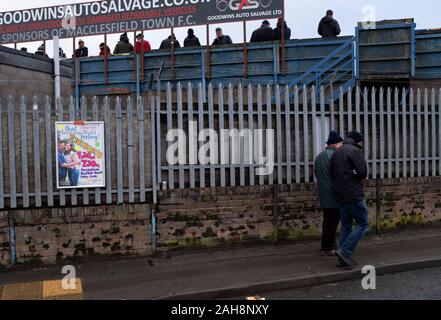 Spectators arriving outside the ground before Macclesfield Town played Grimsby Town in a SkyBet League 2 fixture at Moss Rose. The home club had suffered problems in the run up to this fixture with the EFL deducting points after they failed to pay staff and they had a game postponed. This match ended in a 1-1 draw, watched by a crowd of 1,991. Stock Photo