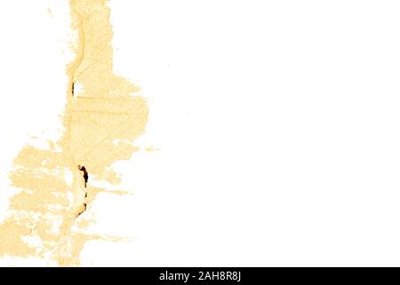Abstract spot smeared crack on a white shabby wall. Stock Photo