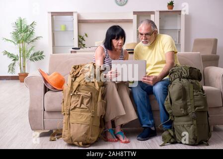 The old couple preparing for vacation travel Stock Photo