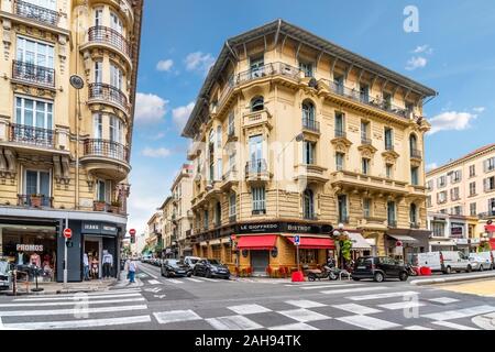 A French Bistro sits on a typical corner near the touristic city center of Nice, France, on the French Riviera.