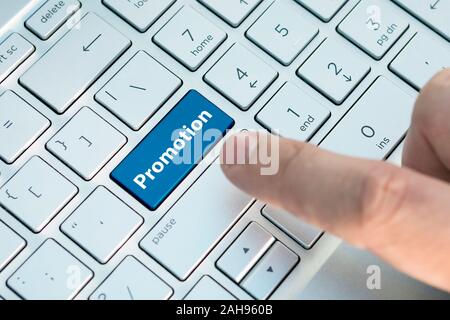 Computer notebook keyboard with promotion key - technology background. Stock Photo