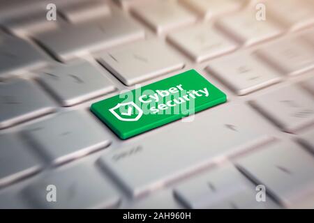 cyber security green button on the keyboard. Stock Photo