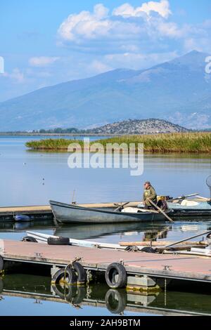 A fisherman on Mikri Prespa lake at the village of Mikrolimni in Macedonia, Northern Greece. Stock Photo