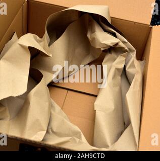 Protective paper packaging inside an Amazon parcel Stock Photo