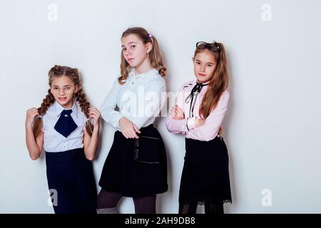 three girls at school boards in the classroom lesson Stock Photo