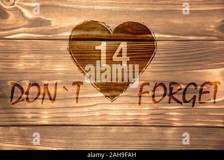 Heart symbol of Valentine's Day on a wooden table top. Stock Photo