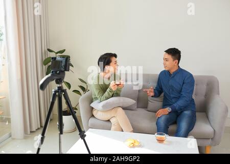Disussion between businessman and businesswoman for business podcast. Stock Photo