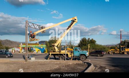Kazakhstan, Ust-Kamenogorsk - 12 September, 2019. Technician is installing CCTV system. Stock Photo