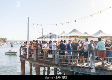 Sydney, Australia - December 30th 2013: People drinking in the Wharf Bay in Manly. The bar is popular on hot sunny days. Stock Photo