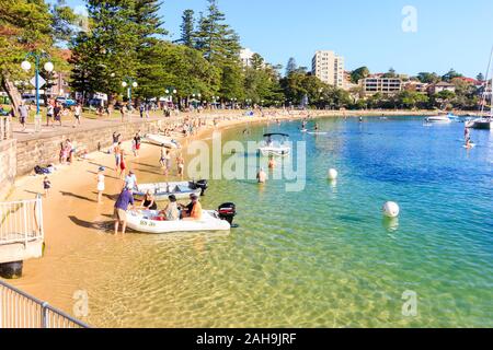 Sydney, Australia - December 30th 2013: People enjoying the beach in Manly Cove. Manly is one of the Northern Beaches Stock Photo