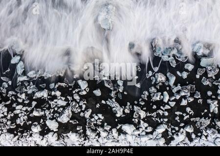 Aerial view of ice floes and icebergs on Diamond beach during sunset. The beginning of spring in Iceland Stock Photo