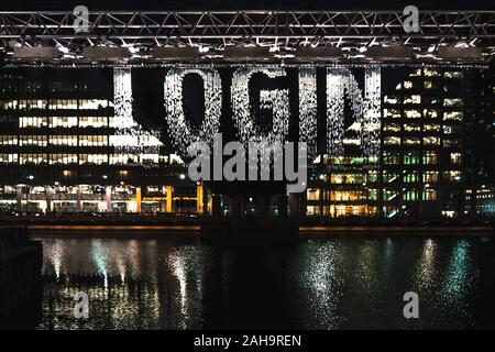 LOG IN sign written on falling water Stock Photo