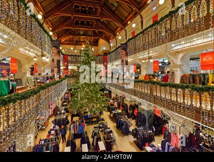 EDINBURGH SCOTLAND INSIDE JENNERS STORE ON PRINCES STREET AT CHRISTMAS TIME WITH TREE AND DECORATIONS