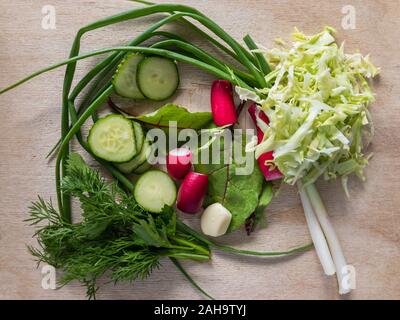 Top view on a cut board with ingredients for vegan spring salad Stock Photo