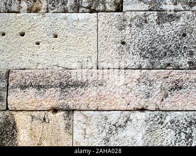 Detail of an ancient stone wall of the Acropolis, Athens, Attica region in Greece. Close-up of huge antique blocks of stone forming a wall. Stock Photo