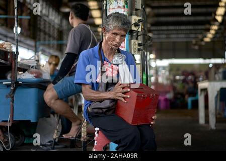 Blind beggar man in a Thailand market Stock Photo