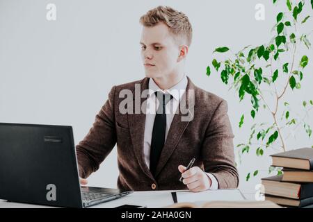 a man works in the Office at the computer business clerk Stock Photo