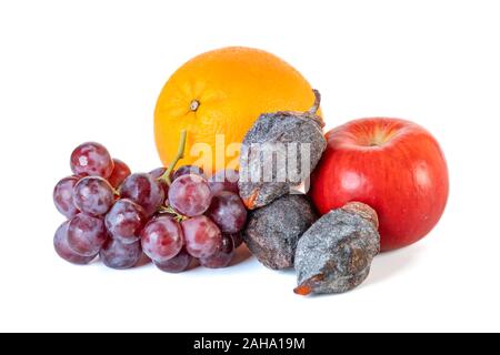 Grape, apple, orange and dry persimmon isolated on white background. Stock Photo