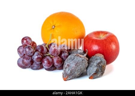 Grape, apple, orange and dry persimmon isolated on white background. Stock Photo