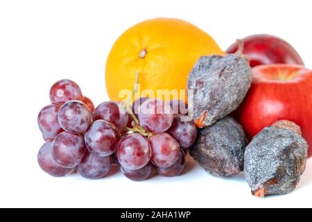 Grape, apple, orange and dry persimmon isolated on white background. Stock Photo