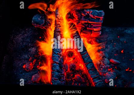 Fiery background. Live coals. Burning firewood. Stock Photo
