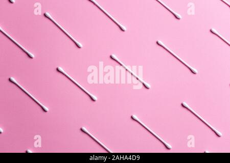 Top view of flat lay composition with cotton swabs on pink background Stock Photo