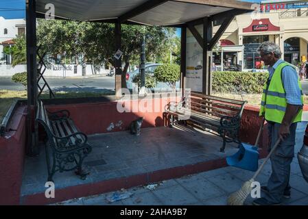 GREECE, KOS - MAY 31: Kardamena is a small town on the south coast of Kos and has all the makings of a great beach holiday. Bus stop on central street Stock Photo