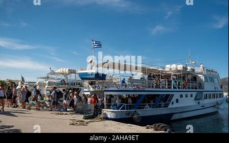 GREECE, KOS - MAY 31: Kardamena is a small town on the south coast of Kos and has all the makings of a great beach holiday. Passenger ship coming to t Stock Photo