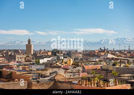 Marrakech city skyline in Medina area, with Atlas mountains behind, Marrakesh-Safi region, Morocco, north Africa. Stock Photo