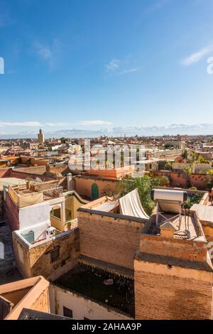 Marrakech city skyline in Medina area, with Atlas mountains behind, Marrakesh-Safi region, Morocco, north Africa. Stock Photo