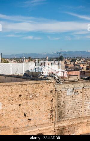 Marrakech city skyline in Medina area, with Atlas mountains behind, Marrakesh-Safi region, Morocco, north Africa. Stock Photo