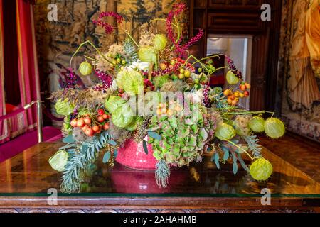 Beautiful green orange flower arrangement in autumn colors in a castle setting Stock Photo