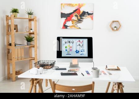 Workplace of contemporary web designer with supplies necessary for work Stock Photo