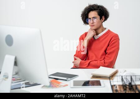 Young creative web designer concentrating on work over new online project Stock Photo