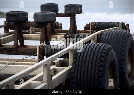 Close up of a boat trailer with large chunky tyres and rubber bumper protection Stock Photo