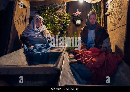 Italy, Sicily, Partinico, December 22/2019, beautiful living nativity scene in the Parrini district, women wash clothes Stock Photo