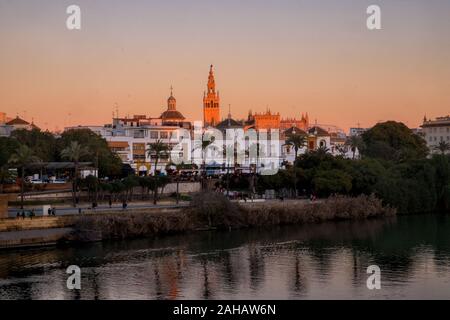 La Giralda at sunset from the west bank of the Guadalquivir River, Seville, Spain Stock Photo