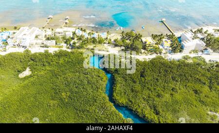 Ocean meets salt Water. Aerial view of Casa Cenote in Tulum, Quintana Roo, Mexico Stock Photo