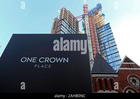 One Crown Place high rise building construction site sign at 54 Wilson Street in Shoreditch East London EC2 England UK  KATHY DEWITT Stock Photo