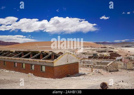Abandoned buildings decay slowly in the abandoned mining settlement ghost town of Mina La Casualidad, in the high Andean puna desert of Salta province in Argentina Stock Photo