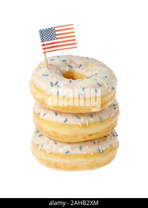 Stacked glazed dounts with an American flag isolated on white background. Stock Photo