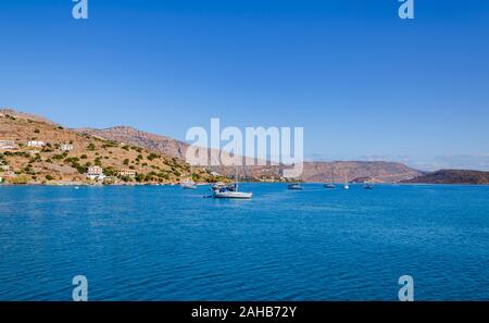 beautiful landscape on a warm sunny day by the sea, with clear transparent water and blue sky, Crete Stock Photo