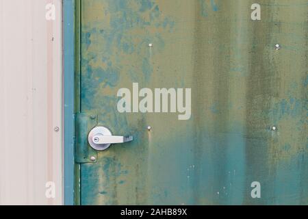 Green metal siding on door background texture Stock Photo