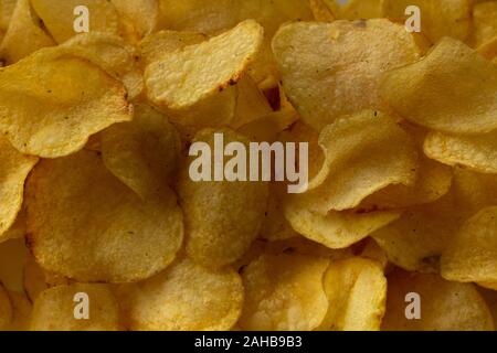 Texture fried golden brown potato chips, close-up Stock Photo