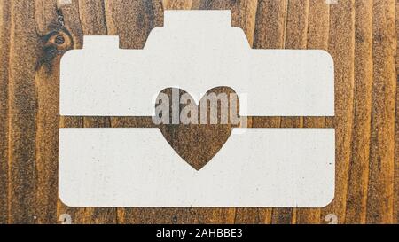I Heart Camera white image on dark wood background texture Stock Photo