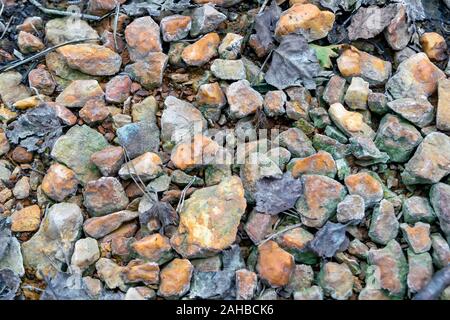 Crushed stones texture background. Stones construction rocks. Grey granite gravel texture background. Top view. Stock Photo