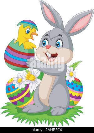Cartoon rabbit holding a baby chick hatching from an Easter egg Stock Vector