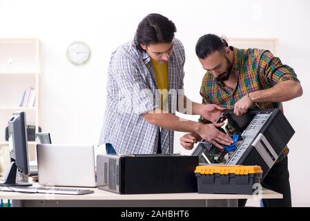 The it engineers working on hardware issue Stock Photo