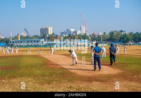 Mumbai, India - December 14, 2019: Indias most famous sport Cricket practiced by kids at local Mumbai ground Stock Photo