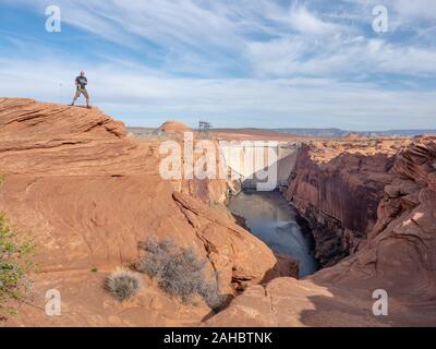 Man standing looking at Colorado River, Glen Canyon Dam, Page, Arizona, USA.   Beginning of the Grand Canyon Stock Photo